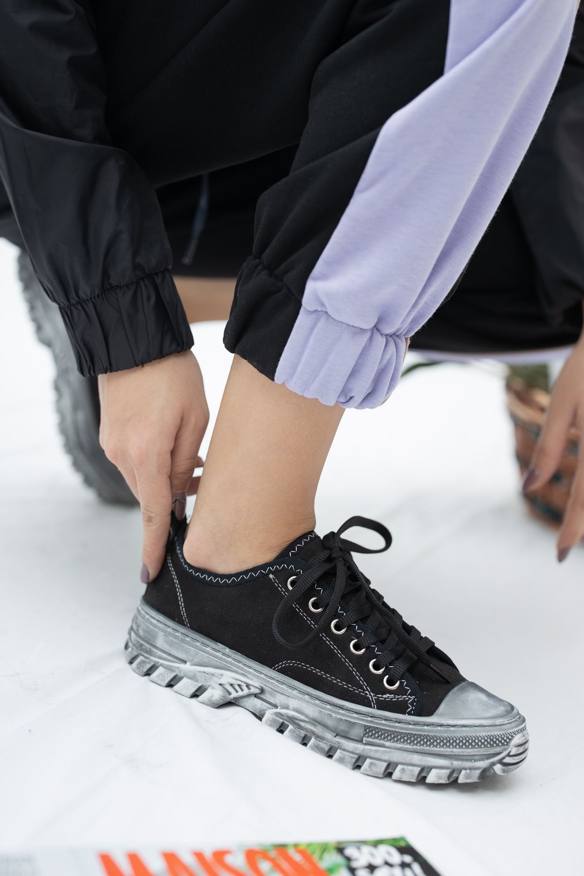 Black sneakers and lace-up front