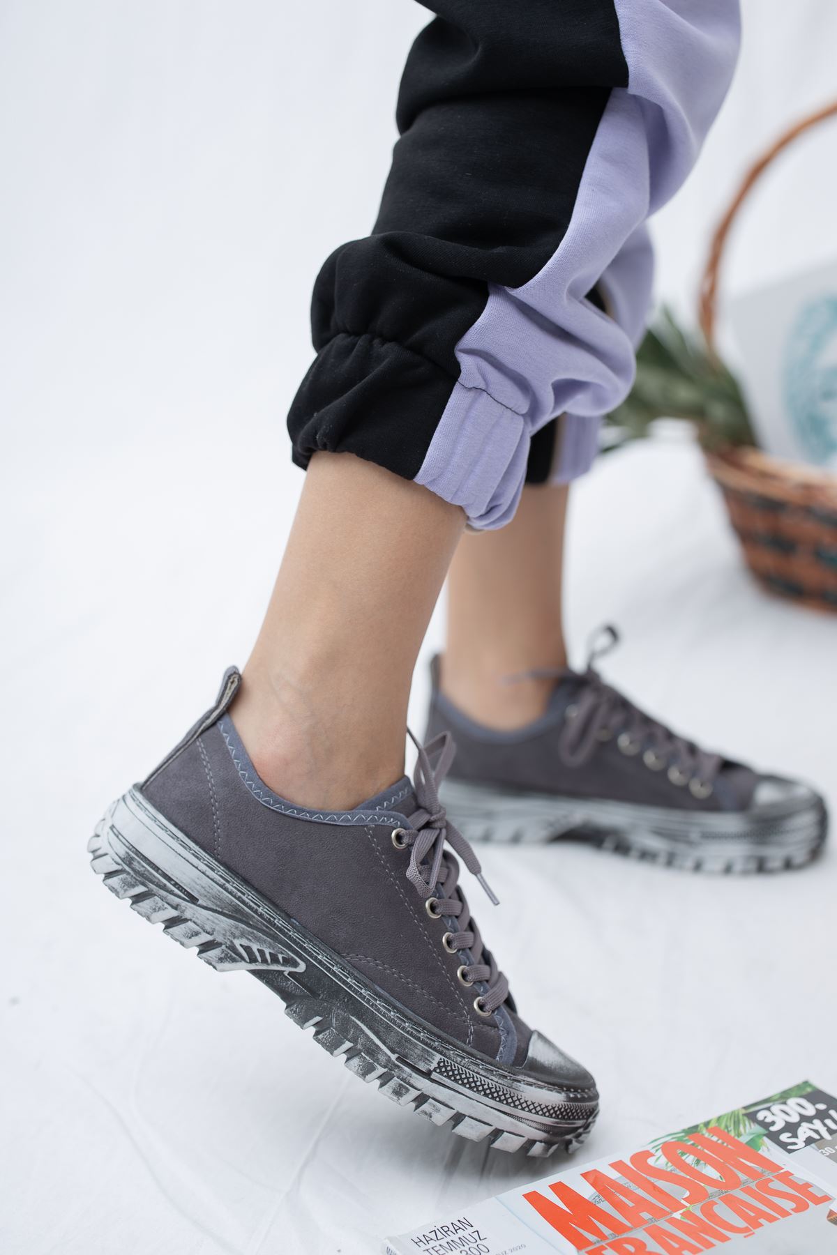 gray sneakers and lace-up front
